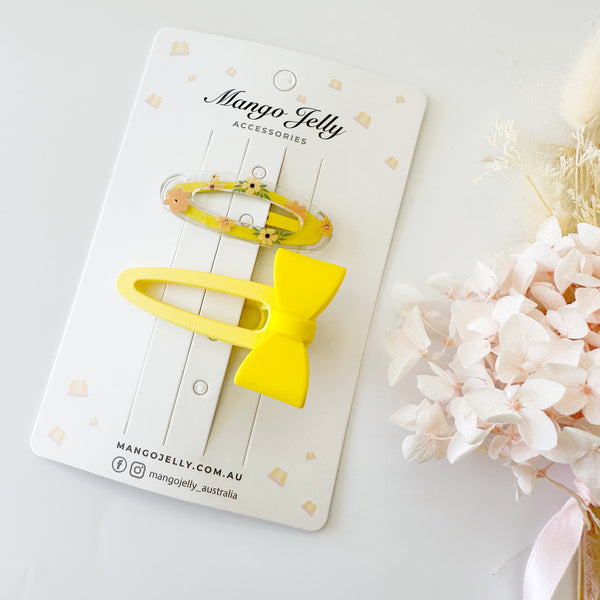 Cute bow clips with matching flower snaps - yellow